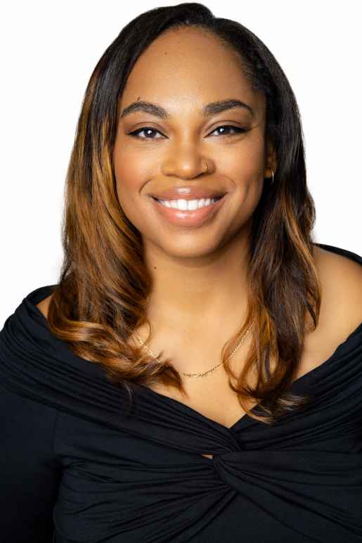 headshot of woman with black shirt